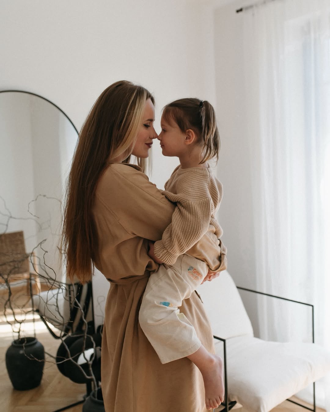 Mother and daughter laughing